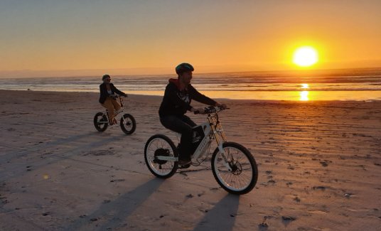 eBike riding at sunset on the beach